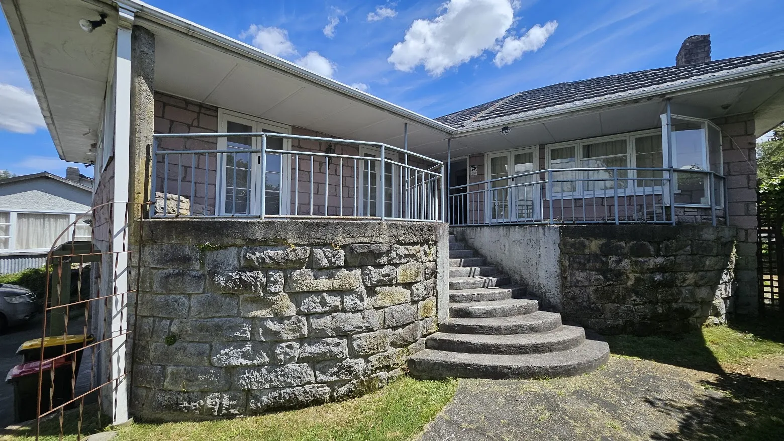 Cut stone wall and curved stone staircase